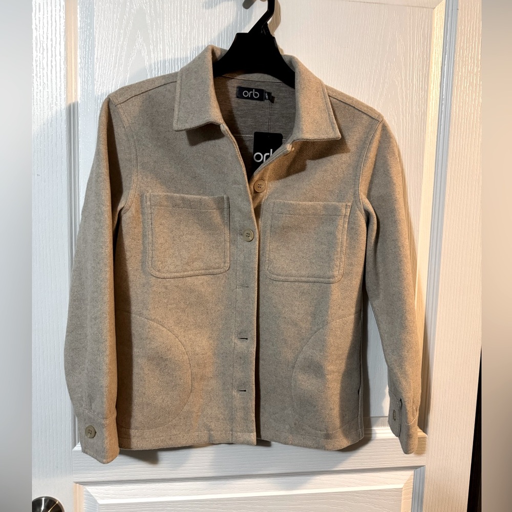 Waist length oatmeal coloured jacket.